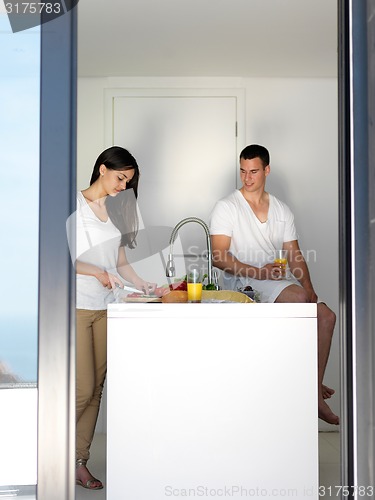 Image of happy young couple in kicthen