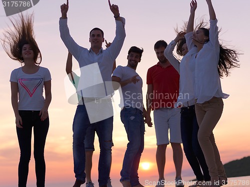 Image of party people  on sunset