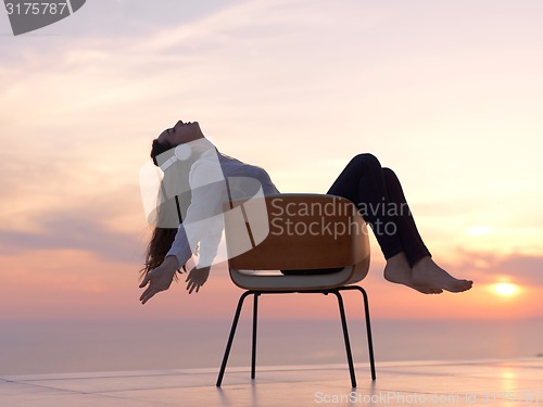 Image of young woman enjoy sunset