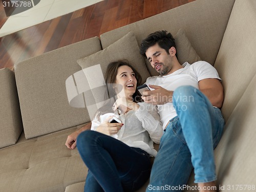 Image of young couple making selfie together at home