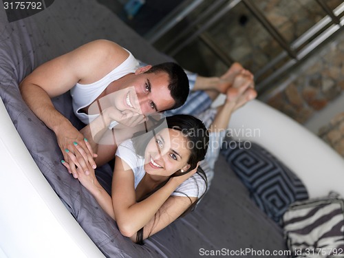 Image of couple relax and have fun in bed