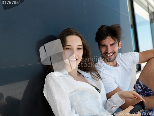 Image of young couple making selfie together at home