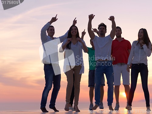 Image of party people  on sunset