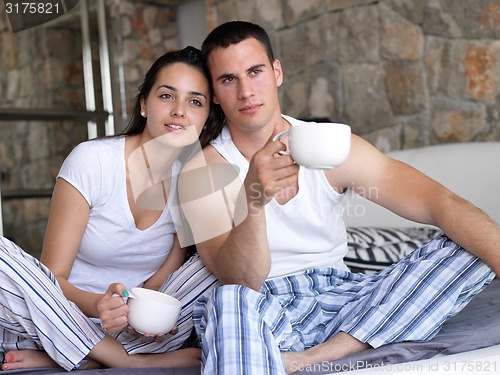 Image of couple relax and have fun in bed