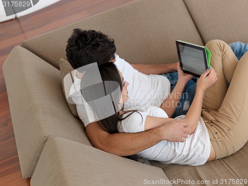 Image of young couple making selfie together at home