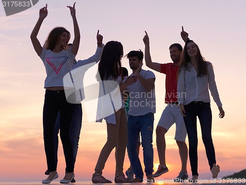 Image of party people  on sunset