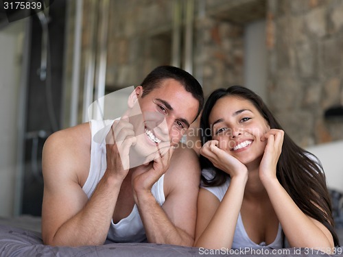 Image of couple relax and have fun in bed