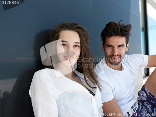 Image of young couple making selfie together at home