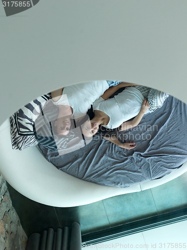 Image of couple relax and have fun in bed