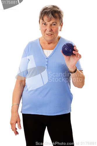 Image of Senior woman with massage ball