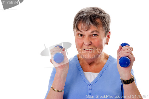Image of Elderly woman exercising with dumbbells