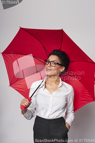 Image of Happy woman with umbrella