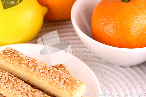 Image of sweet cake on white plate and fruits