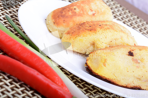 Image of chicken chop with red pepper