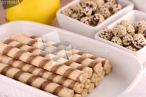 Image of sweet cake on white plate with lemon