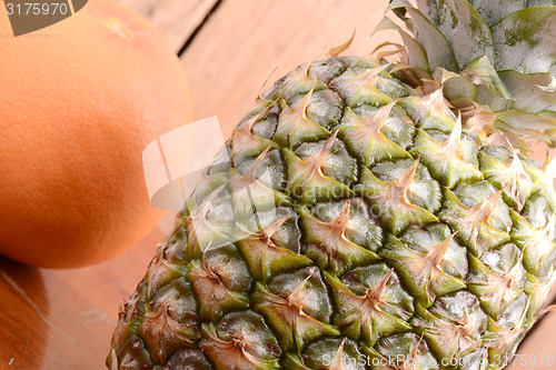 Image of fresh pineapple with orange