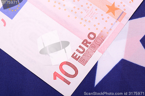 Image of european money on american flag