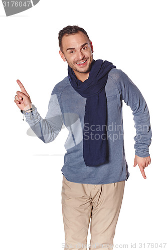 Image of Trendy man pointing to the side