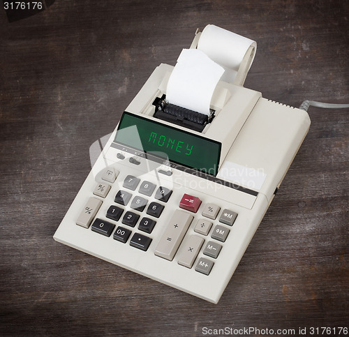 Image of Old calculator - money
