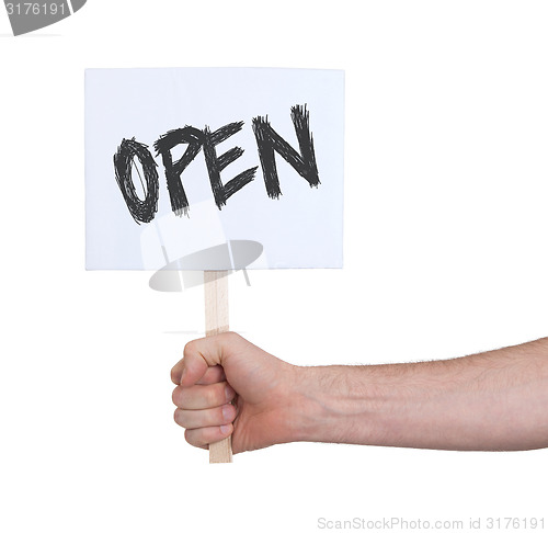 Image of Hand holding sign, isolated on white