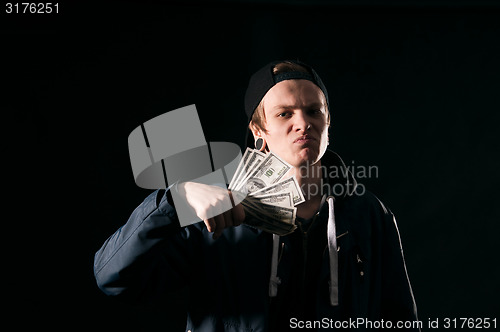 Image of  young man with money in his hands