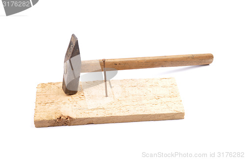 Image of Hammer with nail and board