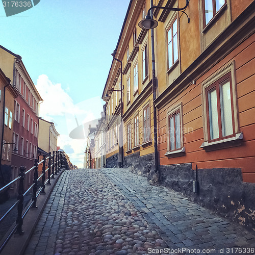 Image of Cobblestone street with old buildings in Stockholm