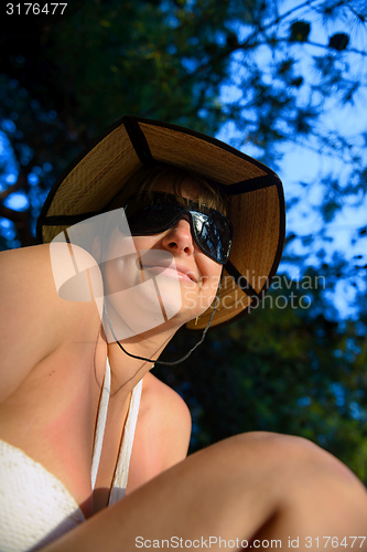 Image of Woman outdoors with nice hat