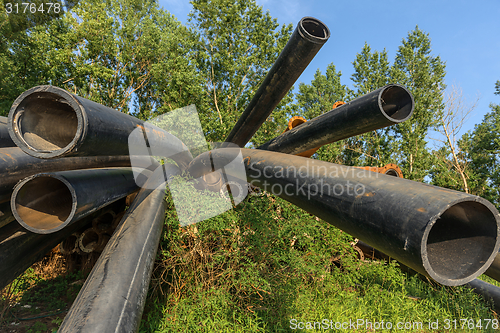 Image of Rusty metal pipes in the forest