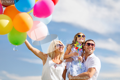 Image of family with colorful balloons