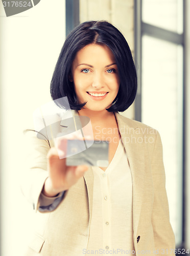 Image of happy woman with credit card