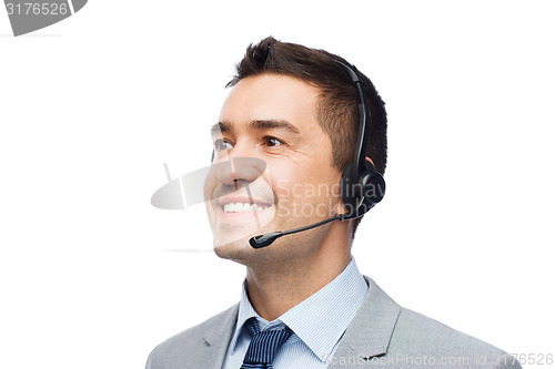 Image of smiling businessman in headset