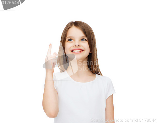 Image of smiling little girl in white blank t-shirt