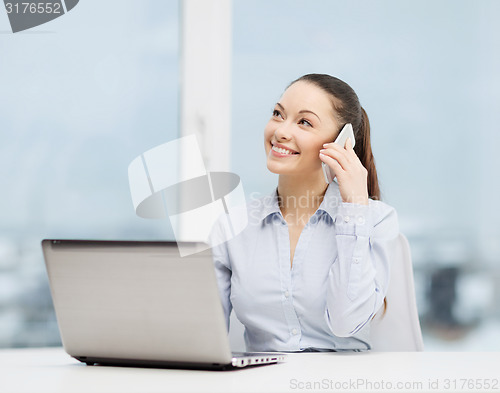 Image of smiling businesswoman with laptop