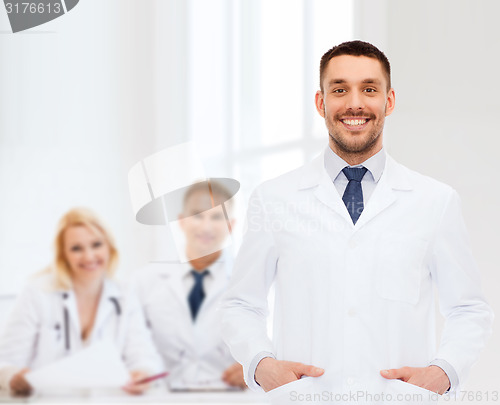 Image of smiling male doctor in white coat