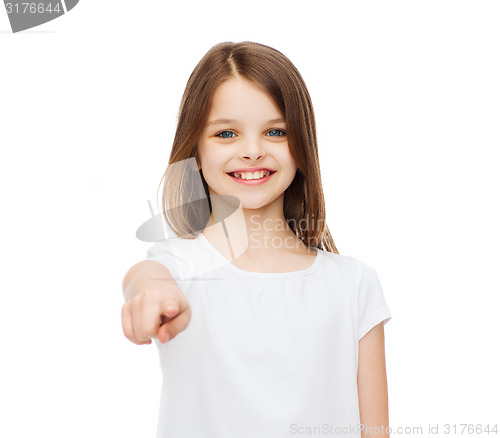 Image of little girl in blank white t-shirt pointing at you