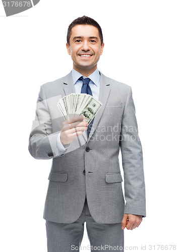 Image of smiling businessman with american dollar money