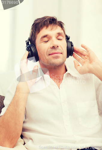 Image of man with headphones listening to music