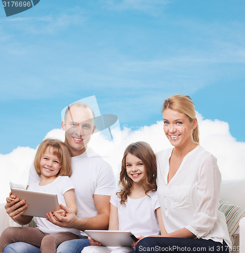 Image of happy family with tablet pc computers