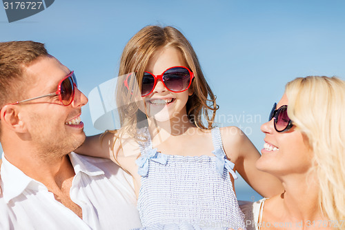 Image of happy family with blue sky