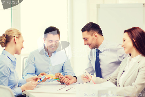 Image of happy team of architects and designers in office