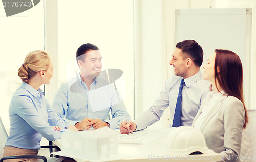 Image of happy team of architects and designers in office