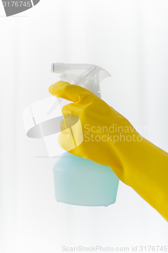 Image of close up of hand with cleanser spraying