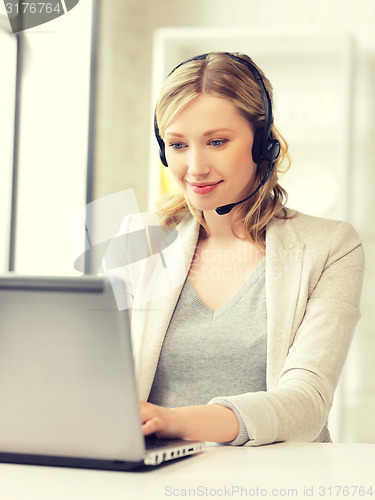 Image of helpline operator with laptop computer