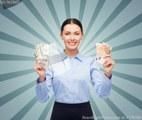 Image of businesswoman with dollar and euro cash money