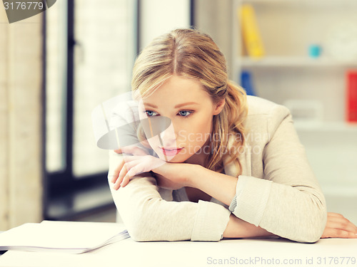 Image of unhappy woman in office