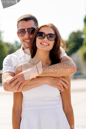 Image of smiling couple in city