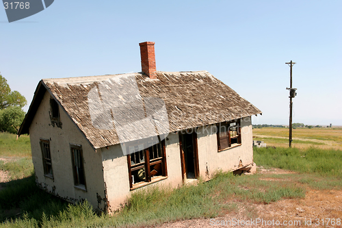 Image of crooked and abandoned home