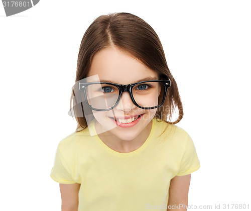 Image of smiling cute little girl in black eyeglasses