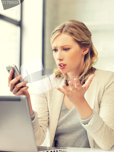 Image of businesswoman with cell phone